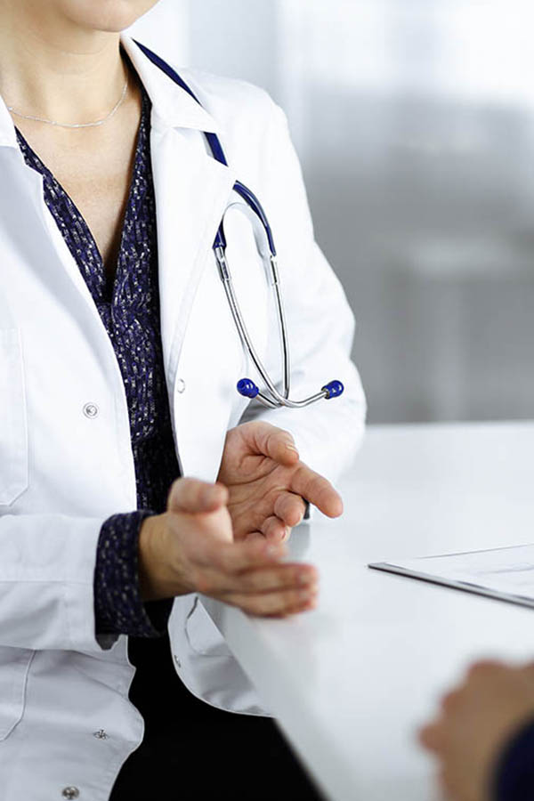 doctor is communicating with client A black and white image of a phone.