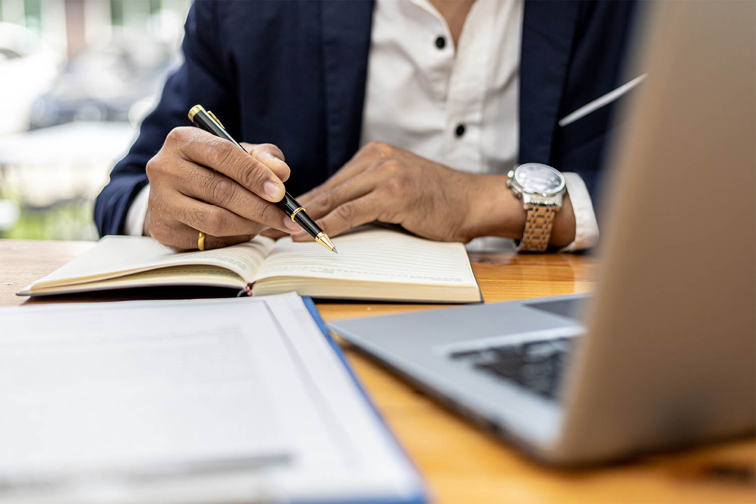 client is reading papers before signing them A black and white image of a phone.