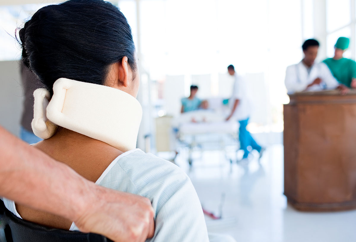 girl is sitting with neck trauma in hospital A black and white image of a phone.